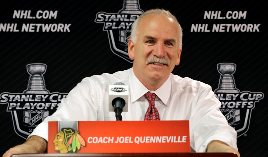 Chicago Blackhawks head coach Joel Quenneville smiles during a news conference after the Blackhawks' 4-3 win over Los Angeles Kings in the second overtime period in Game 5 of the NHL hockey Stanley Cup playoffs Western Conference finals, Saturday, June 8, 2013, in Chicago. The Blackhawks advance to the Stanley Cup finals. (AP Photo/Nam Y. Huh)